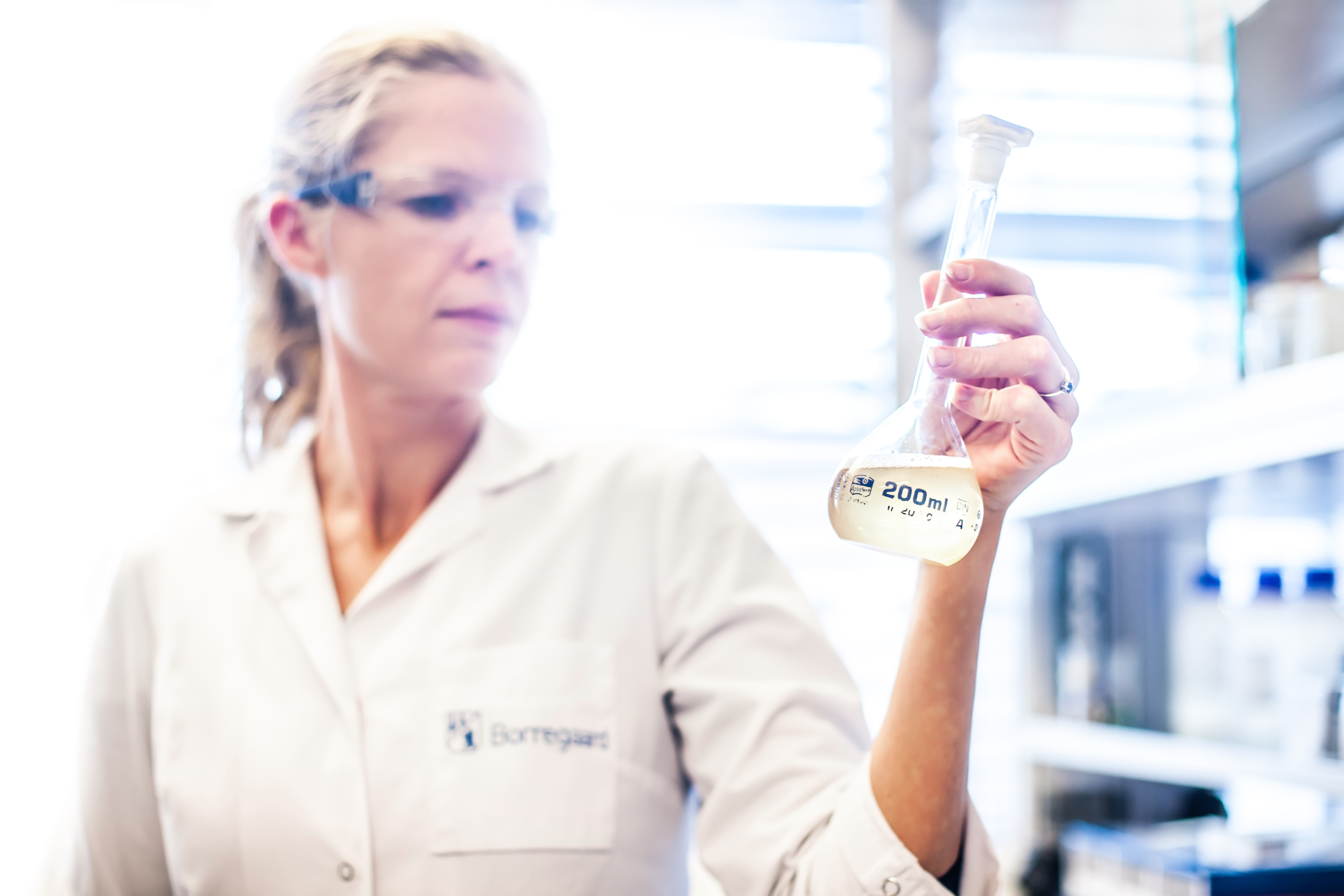 scientist holding test tube