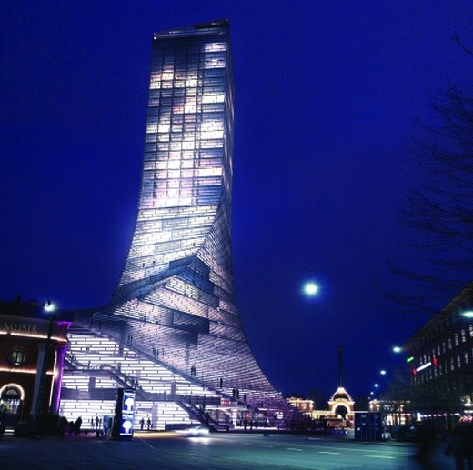 BIG’s architects 130 metre high Scala-project in the centre of Copenhagen (above) will probably not be build. At the rear the gates of Tivoli.